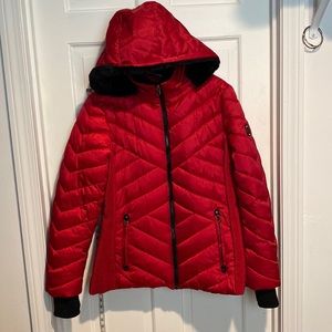 A striking red puffer coat. It’s warm & stylish! Hood can be detached.
